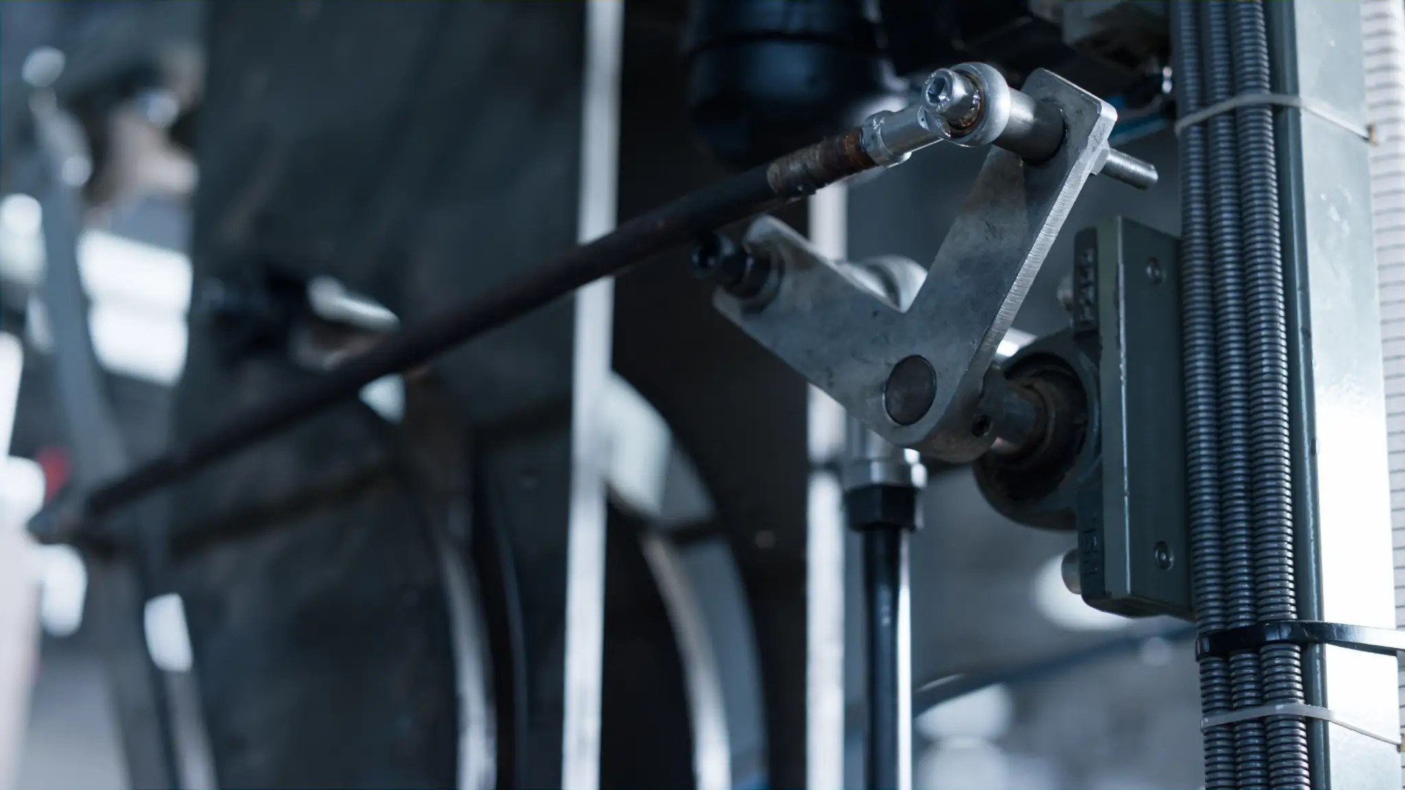 Close-up of industrial machinery with metal rods and components
