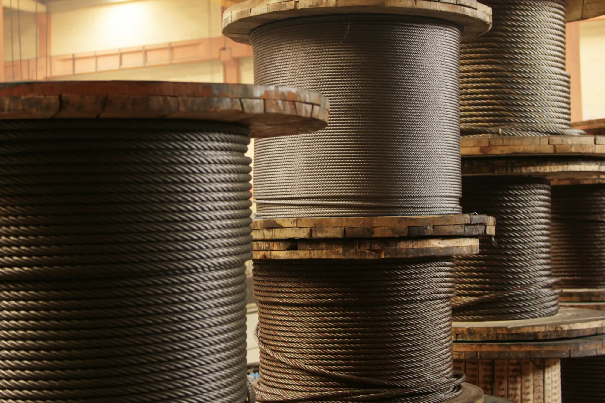 Large spools of wire rope in an industrial setting